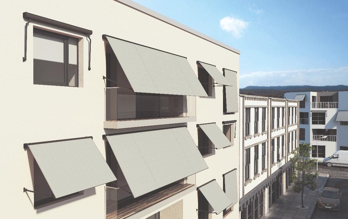 Coastal Halo retractable window awnings on a modern building facade